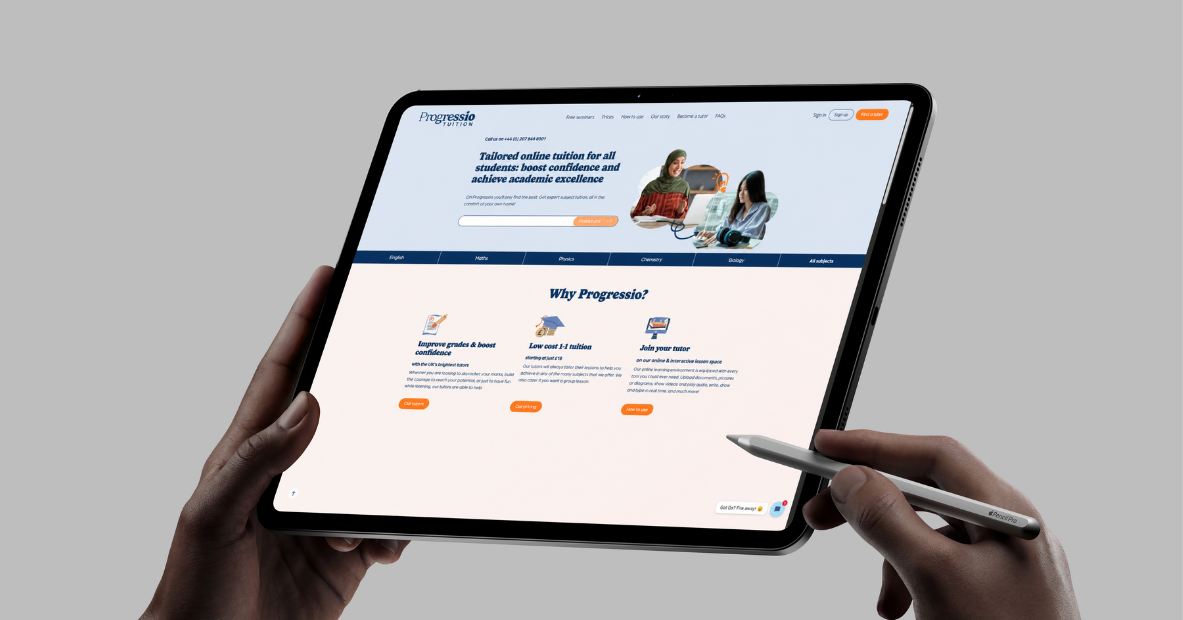Hands using a tablet displaying the Progressio Tuition platform homepage and its online tutoring features.